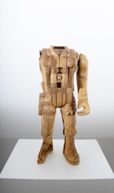 A broken toy soldier, scaled up and hand carved out of wood.