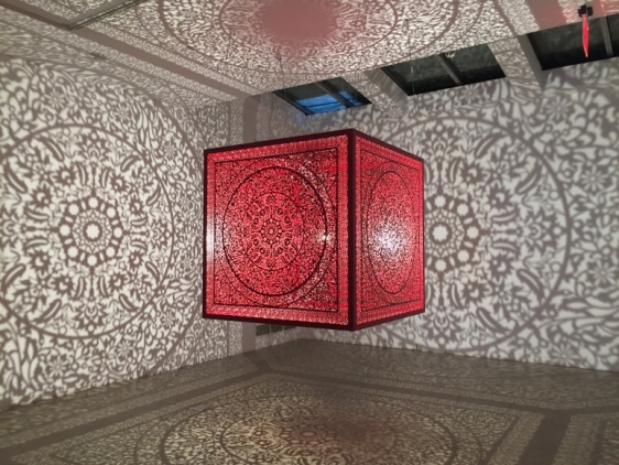 Anila Quayyum Agha  All the Flowers Are for Me (Red - Ed. of 2)  2016   Laser-cut red lacquered stainless steel and bulb  60 x 60 x 60 in.
