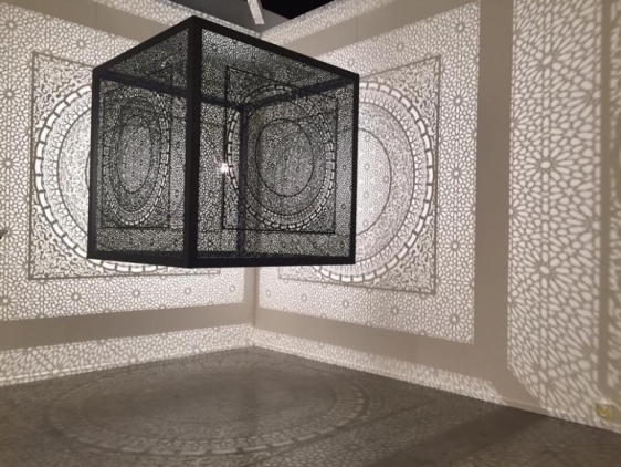 Anila Quayyum Agha SUBLIME LIGHT (Ed. of 5) 2015 Laser-cut black lacquered steel and light bulb 60 x 60 x 60 in.